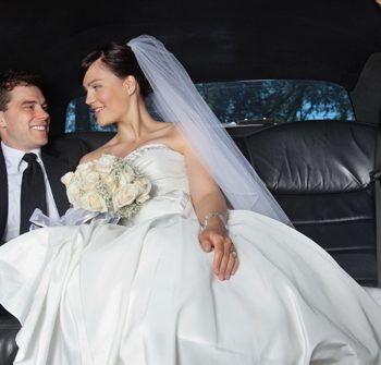 UK and Europe Weddings married couple being chauffeured to wedding reception